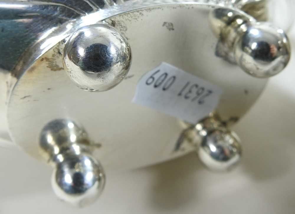 An Edwardian silver three piece tea service, with half gadrooned decoration, comprising a teapot, - Image 7 of 9