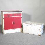 A 1950's painted kitchen cabinet, together with a painted hardwood trunk (2)