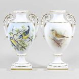 A pair of Royal Worcester porcelain vases, each of twin handled baluster shape, painted with a