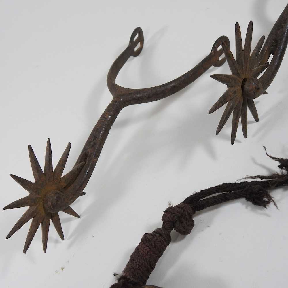 A pair of antique iron spurs, together with a 19th century powder flask (2) - Image 2 of 3