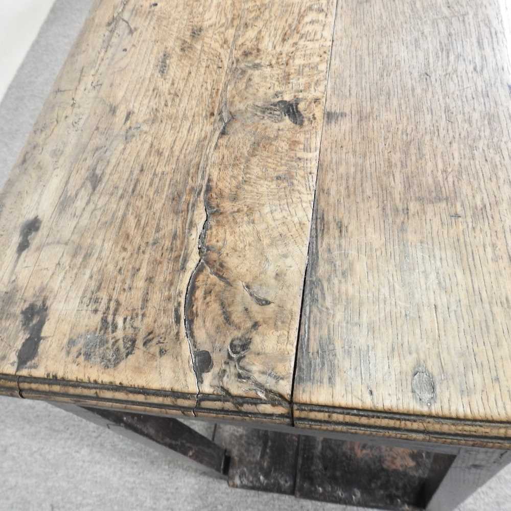 An 18th century Welsh dresser base, of narrow proportions, with an undulating frieze, on square - Image 5 of 19