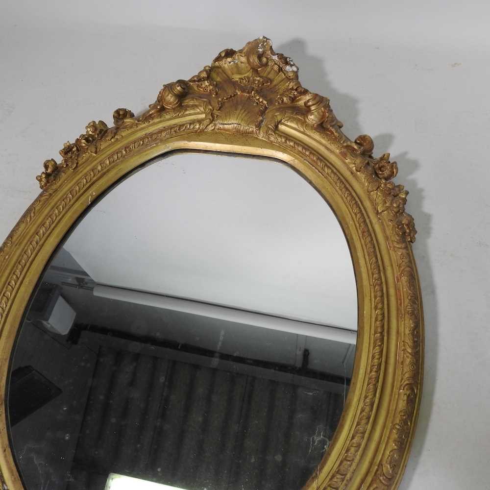 A 19th century carved pine and gilt gesso framed wall mirror, of oval shaped, with an acanthus - Image 3 of 14