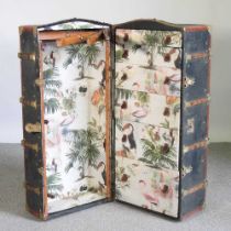 An early 20th century travel trunk, the fitted interior decorated with flamingos and toucans 53w x