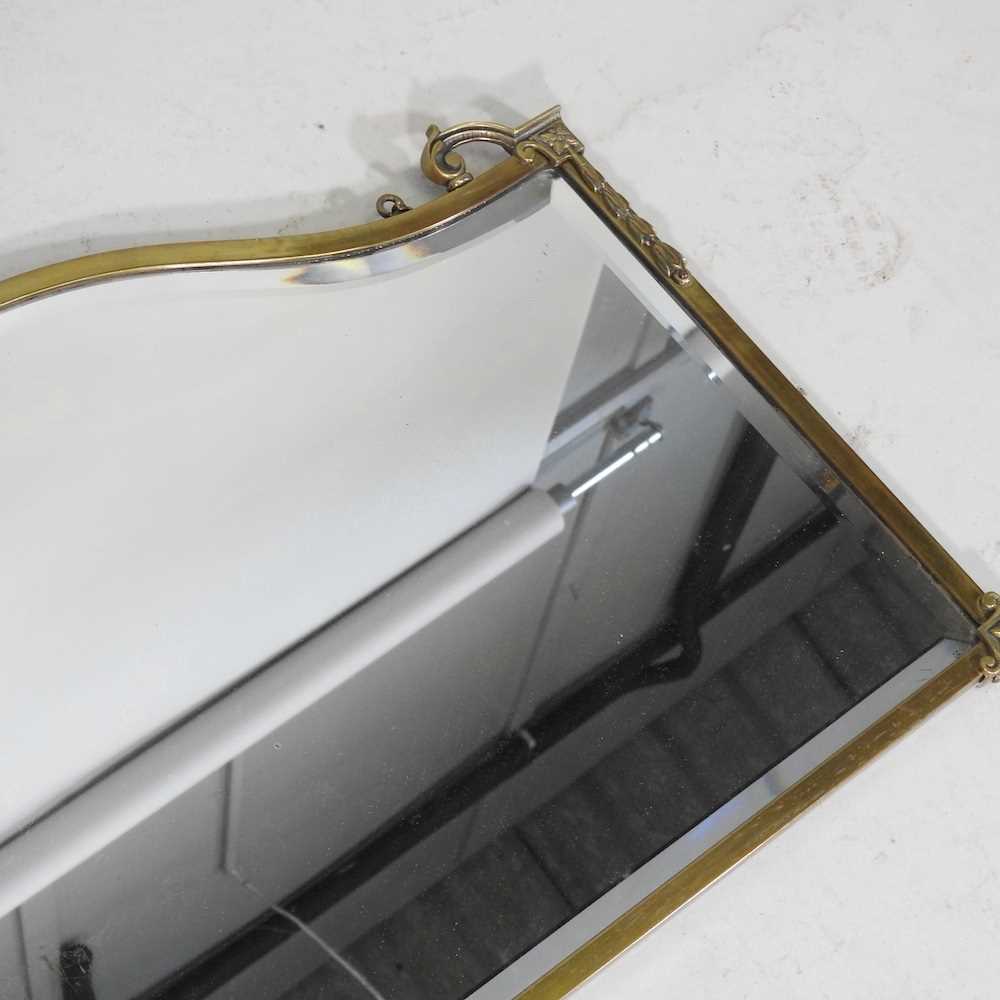 An early 20th century brass framed wall mirror, 46 x 67cm, together with a collection of stair rods - Image 4 of 6