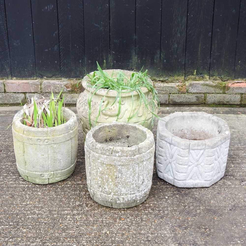 A collection of four cast stone garden pots (4)