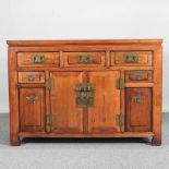 A modern Chinese hardwood sideboard, containing short drawers and cupboards 126w x 50d x 88h cm