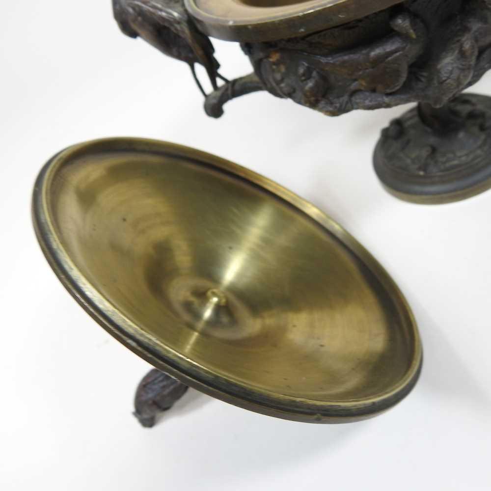 A 19th century cast bronze cup and cover, of pedestal form, decorated in relief with game, flanked - Image 5 of 12