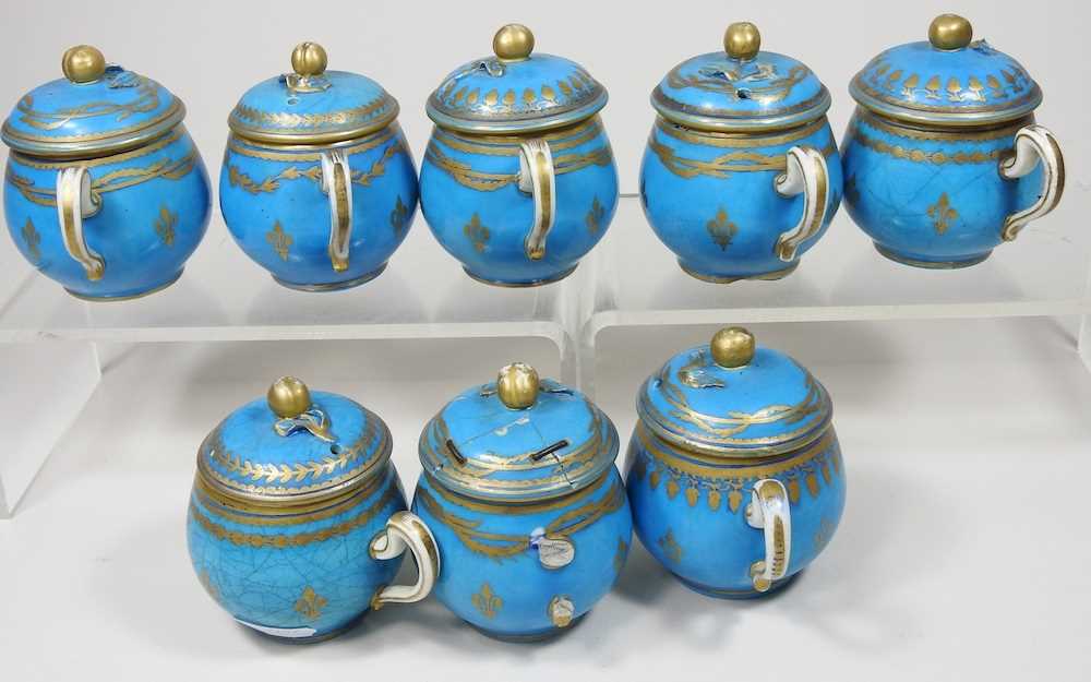 A set of eight 19th century Sevres porcelain custard cups and covers, with gilt decoration on a blue - Image 12 of 15