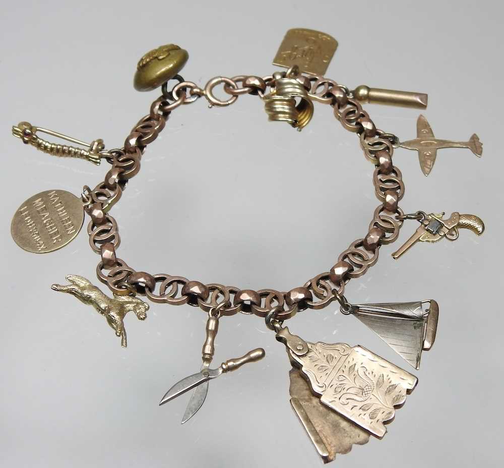 An early 20th century charm bracelet, suspended with a collection of twelve various novelty - Image 2 of 9