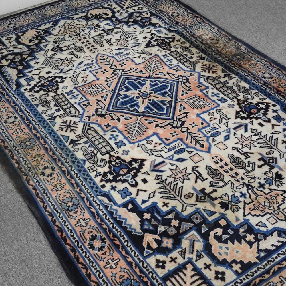 A Turkish woollen rug, with a central medallion, on a blue ground, 256 x 159cm - Image 3 of 6