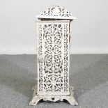An early 20th century cream painted cast iron conservatory heater, 54cm high