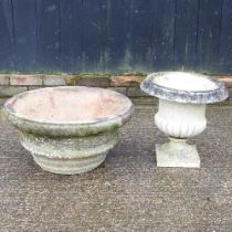 A cast stone garden urn, 41cm high, together with another (2)
