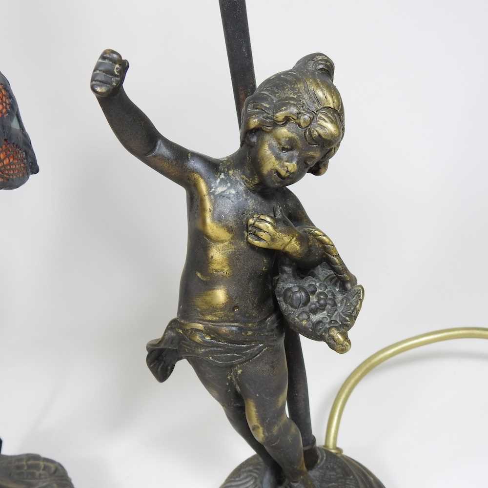 A converted brass oil lamp, together with a Tiffany style table lamp and a figural table lamp (3) - Image 3 of 5