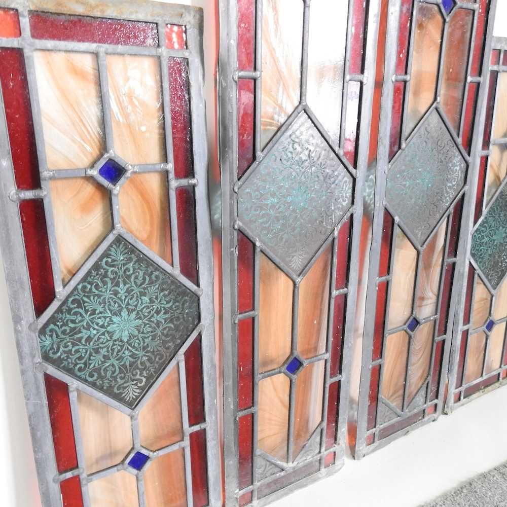 A pair of leaded stained glass windows, together with another smaller (3) 74 x 17cm and 54 x 17cm. - Image 2 of 2