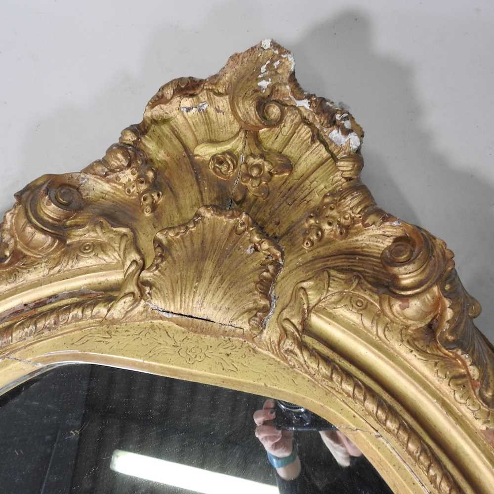 A 19th century carved pine and gilt gesso framed wall mirror, of oval shaped, with an acanthus - Image 4 of 14