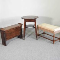 An early 20th century Arts and Crafts oak occasional table, 60cm wide, together with a stool and