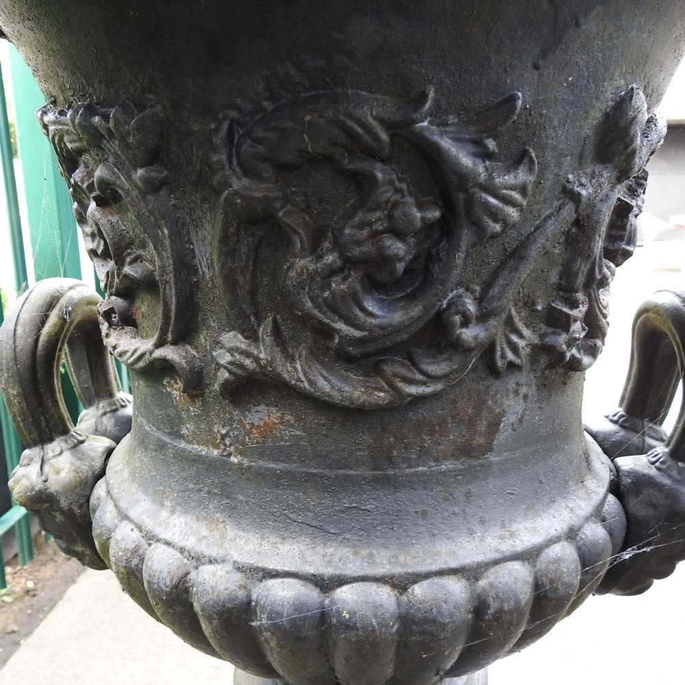 A pair of impressive black painted cast iron garden urns, each of classical design, with an acanthus - Image 4 of 9