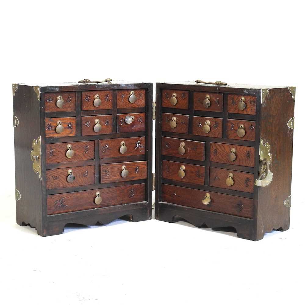 A Chinese elm and brass mounted table cabinet, mid 20th century, containing short drawers 30w x