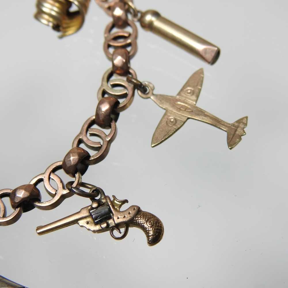 An early 20th century charm bracelet, suspended with a collection of twelve various novelty - Image 3 of 9