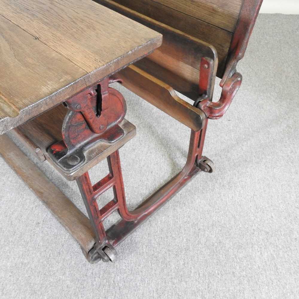 An early 20th century wooden school desk, on an iron base, stamped LEC 102w x 70d x 66h cm - Bild 5 aus 5