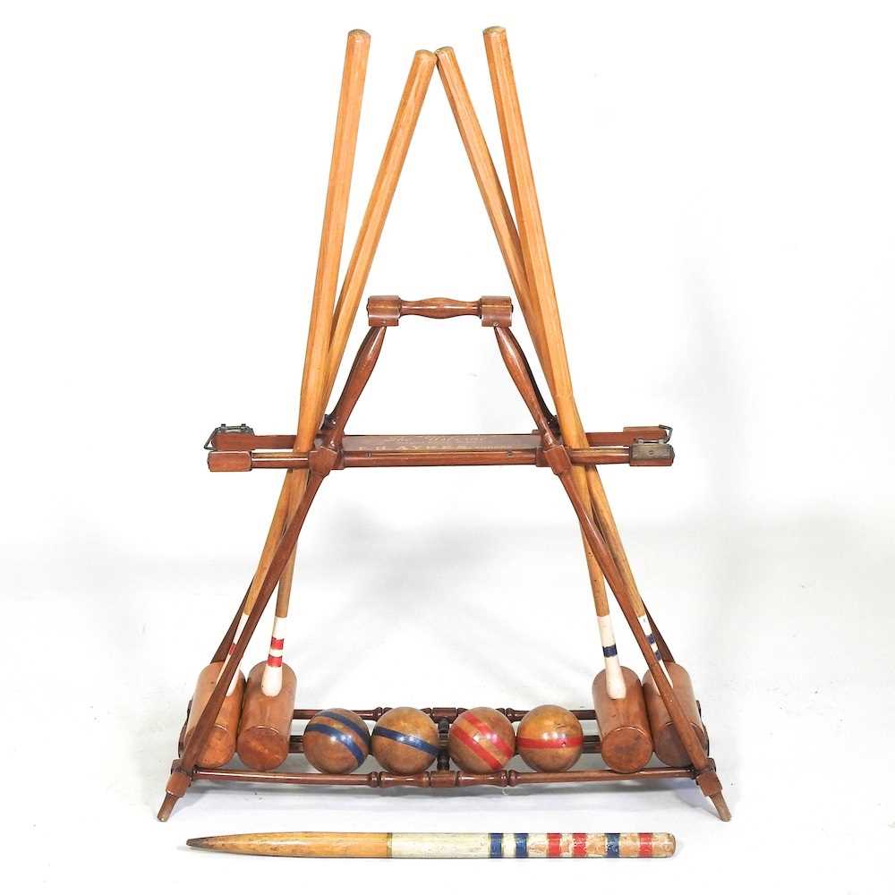 A mid 20th century F.H. Ayers, London wooden The Usborne patent Croquet Carrier Stand, with four