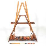 A mid 20th century F.H. Ayers, London wooden The Usborne patent Croquet Carrier Stand, with four