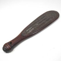 A Maori hardwood short paddle, carved in low relief with geometric designs, 39cm long