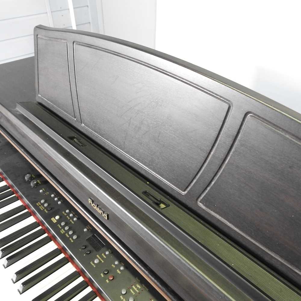 A Roland digital piano, HP107e, 141cm wide, with a piano stool - Image 13 of 13