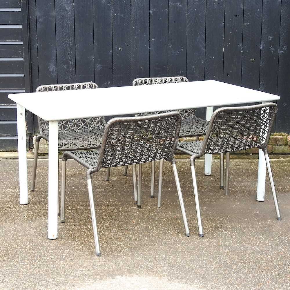 A metal glass top garden table and four woven garden chairs (5) 156w x 78d x 72h cm