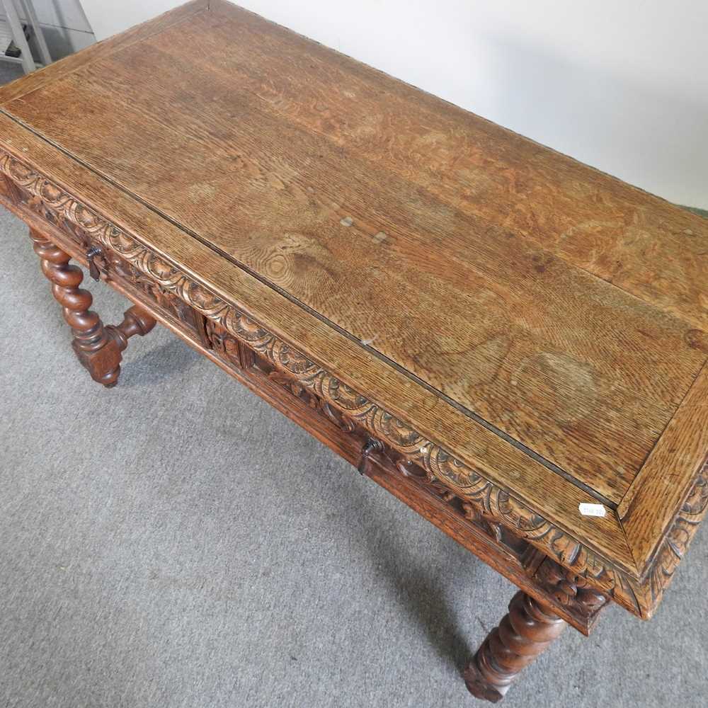 An early 20th century carved oak writing table, on spirally turned supports 120w x 60d x 75h cm - Image 3 of 5