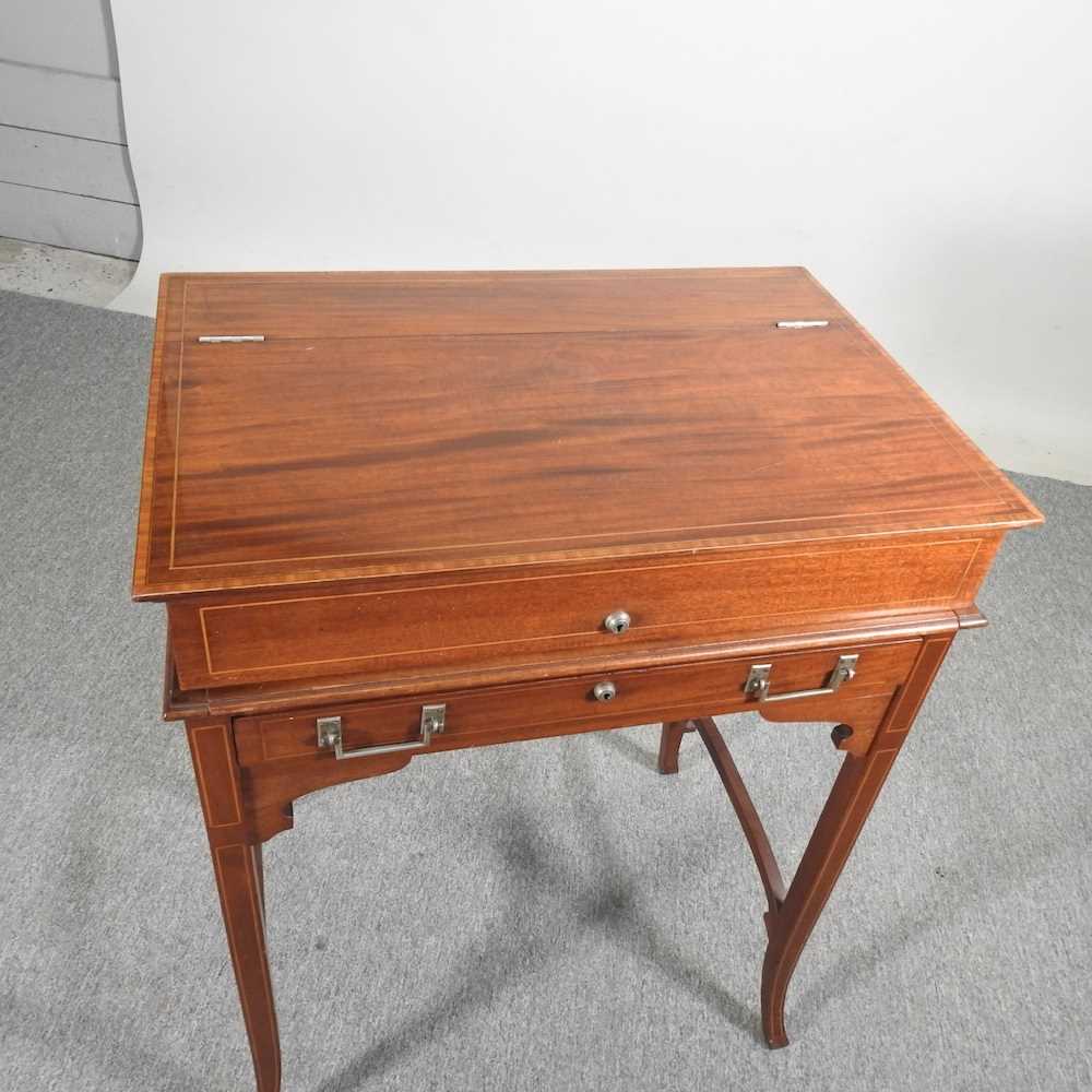 An early 20th century mahogany military style writing desk, with a dual hinged top, revealing a - Image 8 of 9