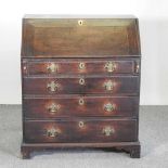 A George III oak bureau 84w x 50d x 99h cm Overall condition is solid and usable, but scruffy and