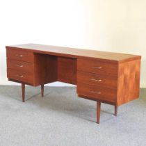 A 1970's teak desk, containing six short drawers 168w x 44d x 70h cm