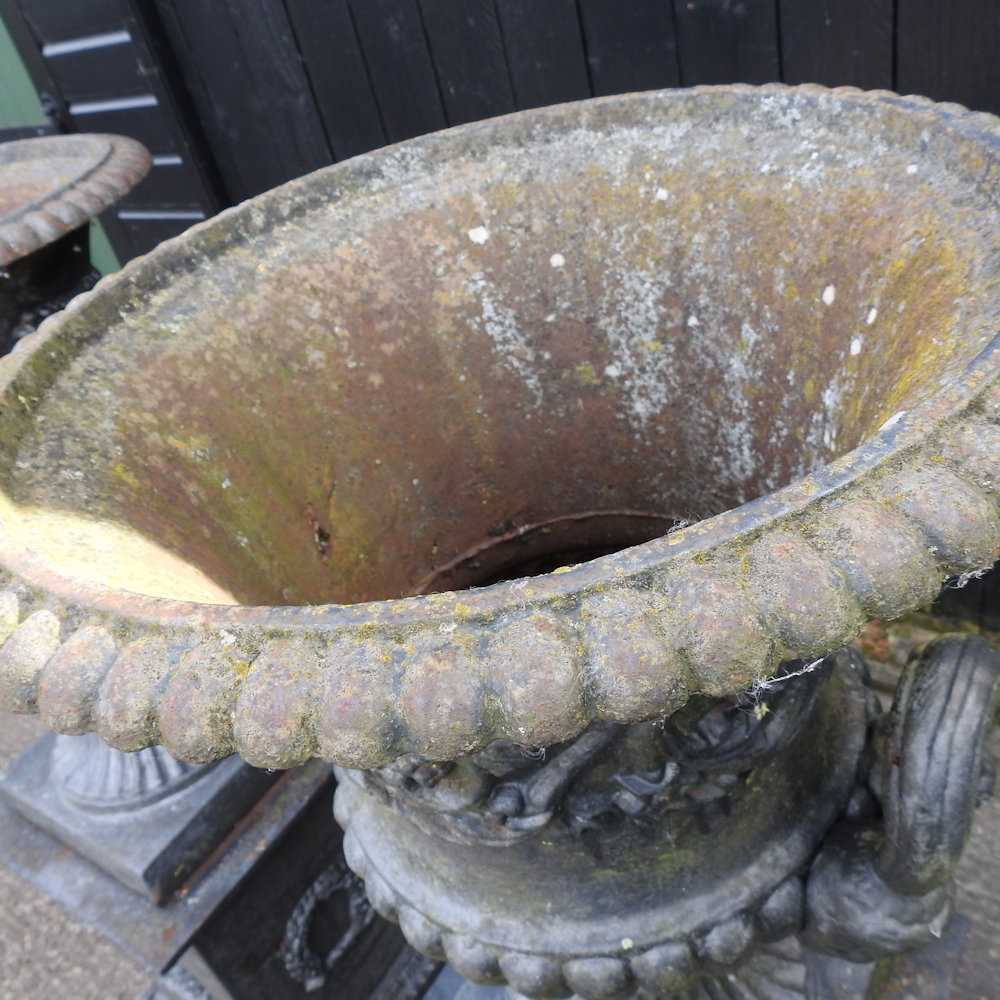 A pair of impressive black painted cast iron garden urns, each of classical design, with an acanthus - Image 7 of 9