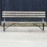A slatted garden bench, on painted iron supports 183w x 50d x 82h cm