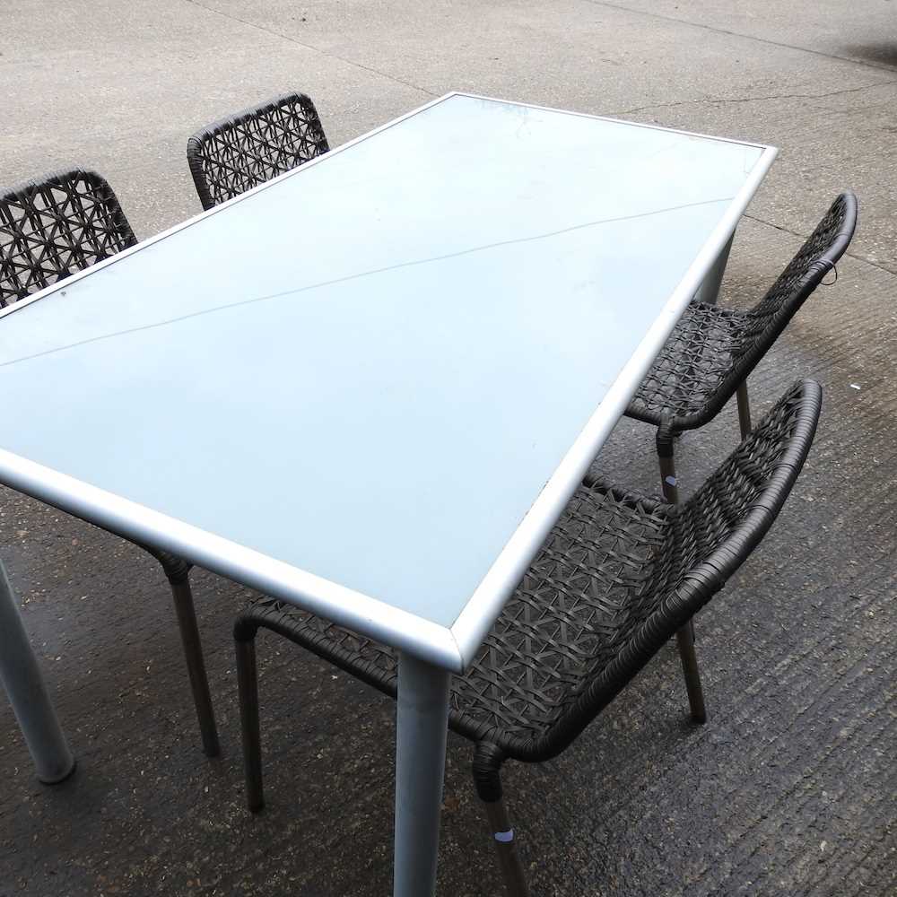 A metal glass top garden table and four woven garden chairs (5) 156w x 78d x 72h cm - Image 3 of 3