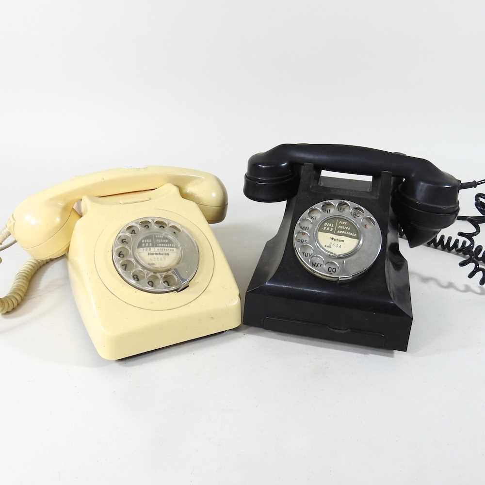A vintage black bakelite telephone, together with another (2)