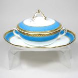 A 19th century Minton tureen and cover on stand, with a blue and gilt border, impressed marks to