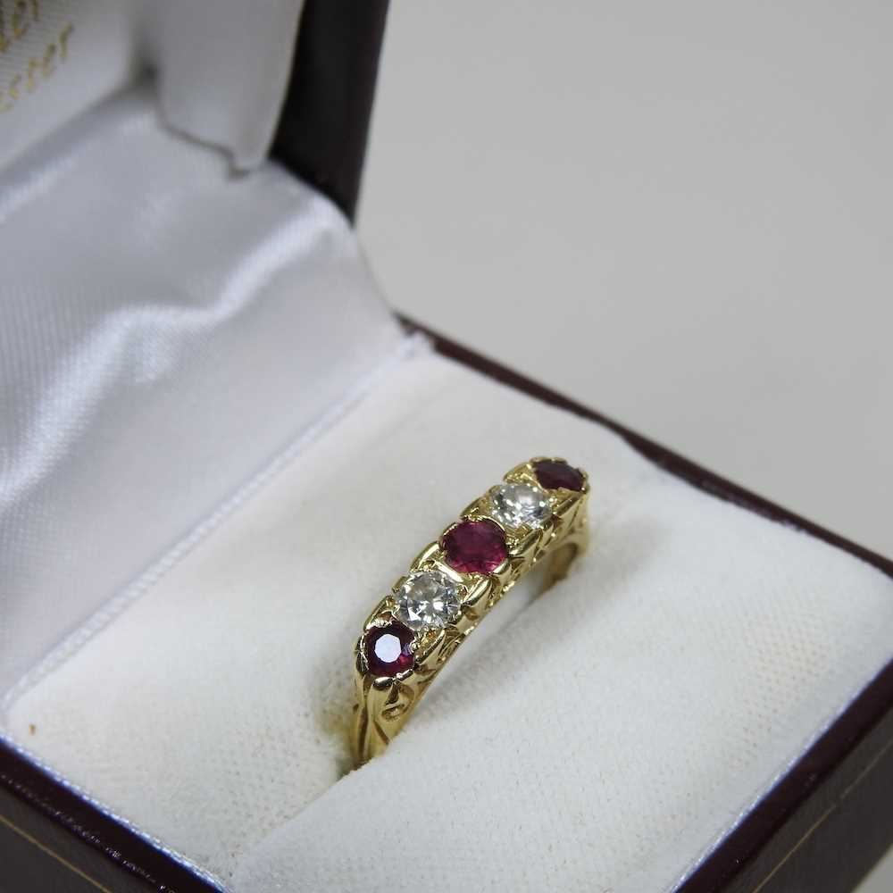 An 18 carat gold ruby and diamond ring, set with five alternating stones, 2.9g, size M, boxed - Image 7 of 7