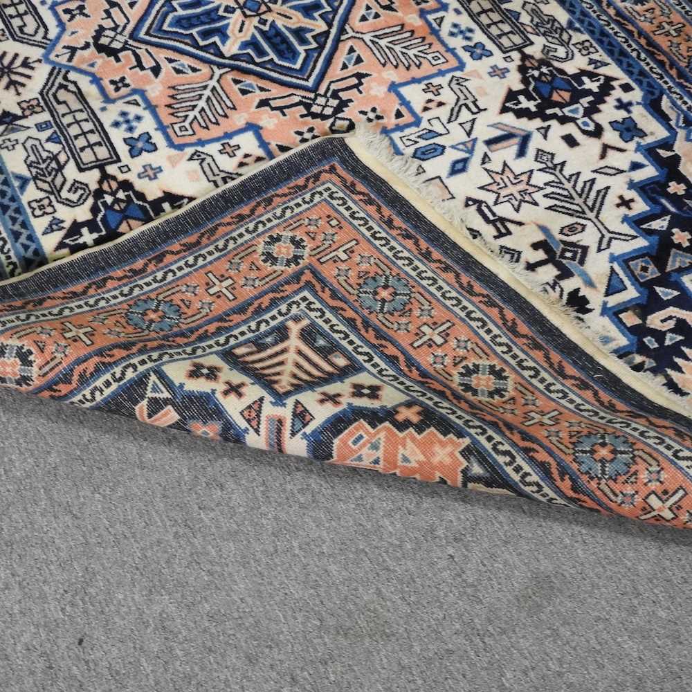 A Turkish woollen rug, with a central medallion, on a blue ground, 256 x 159cm - Image 4 of 6