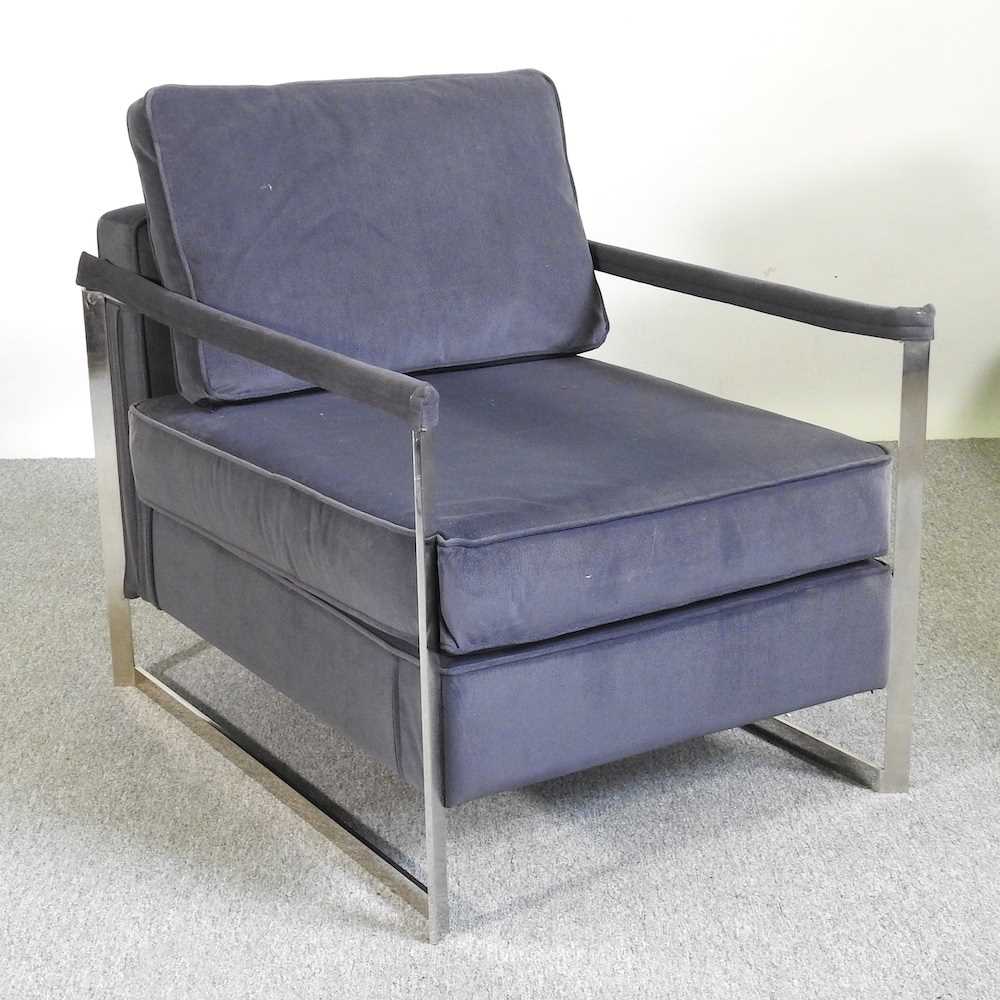 A contemporary chrome armchair, of angular design 67cm wide