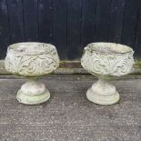 A pair of cast stone garden pots, on pedestal bases, 48cm high (2()