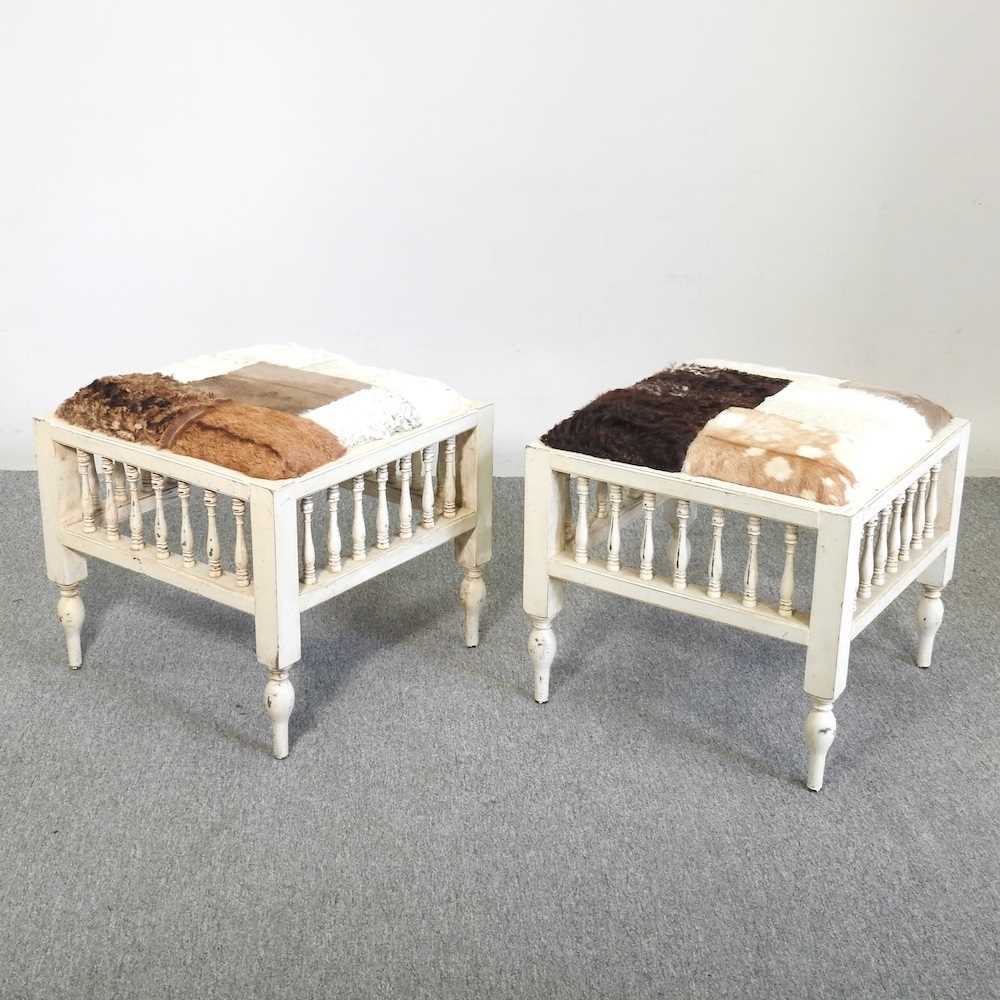 A pair of animal fur upholstered footstools, each with a painted base (2) 50w x 50d x 45h cm