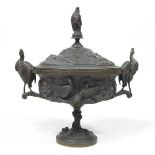 A 19th century cast bronze cup and cover, of pedestal form, decorated in relief with game, flanked
