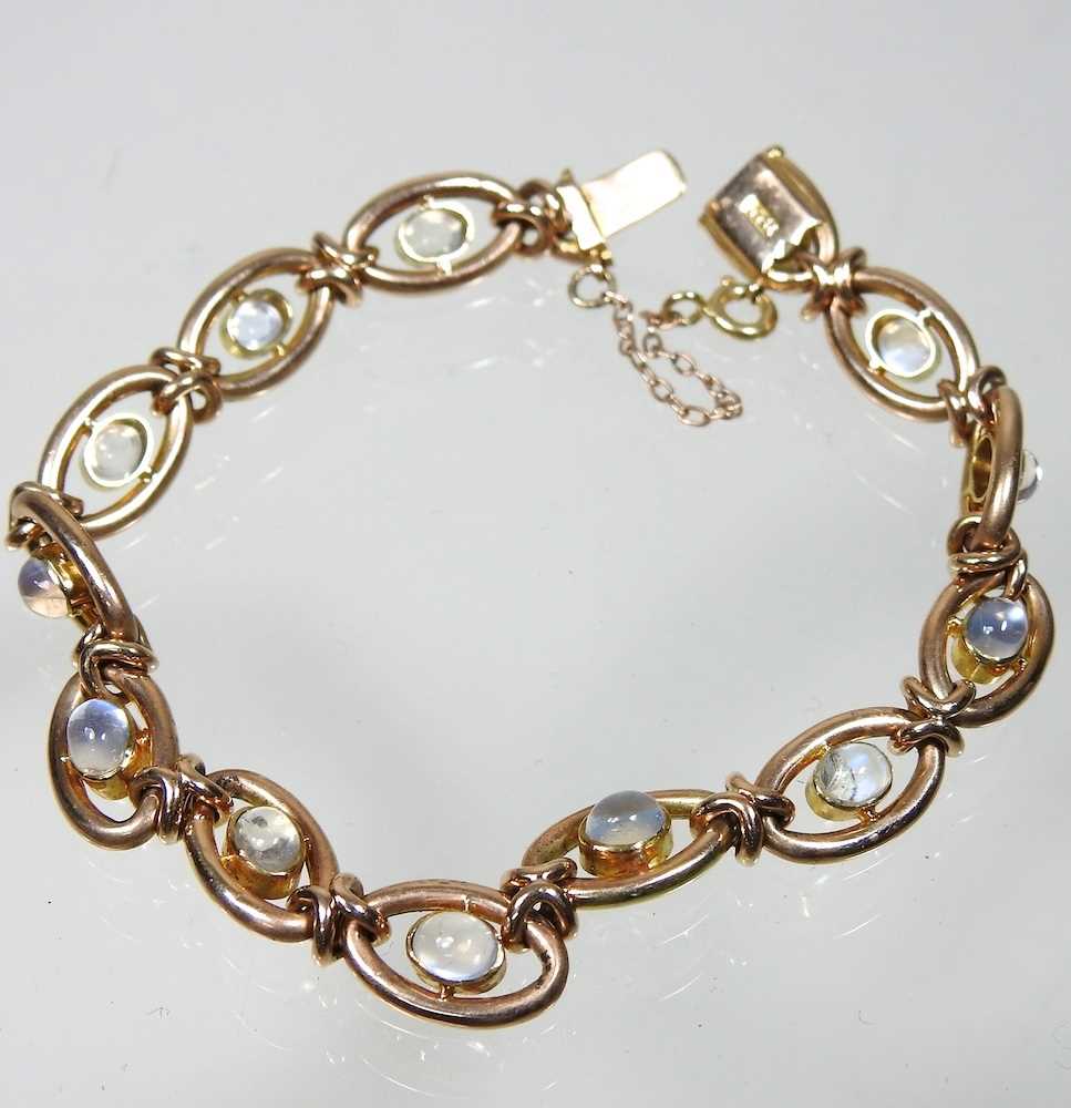 A 15 carat gold and moonstone fancy link bracelet, set with a single row of cabochon stones, - Image 5 of 5