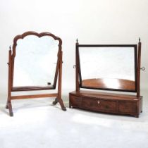 A Regency mahogany and ebony strung bow front toiletry mirror, 56cm wide, together with another.