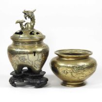 A Chinese bronze censer, on a carved hardwood stand, 29cm high overall, together with a smaller