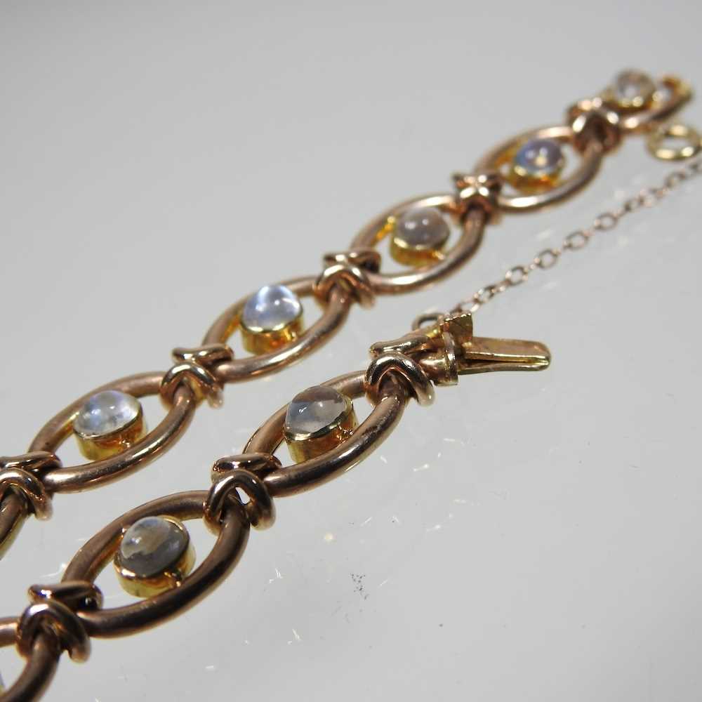 A 15 carat gold and moonstone fancy link bracelet, set with a single row of cabochon stones, - Image 3 of 5