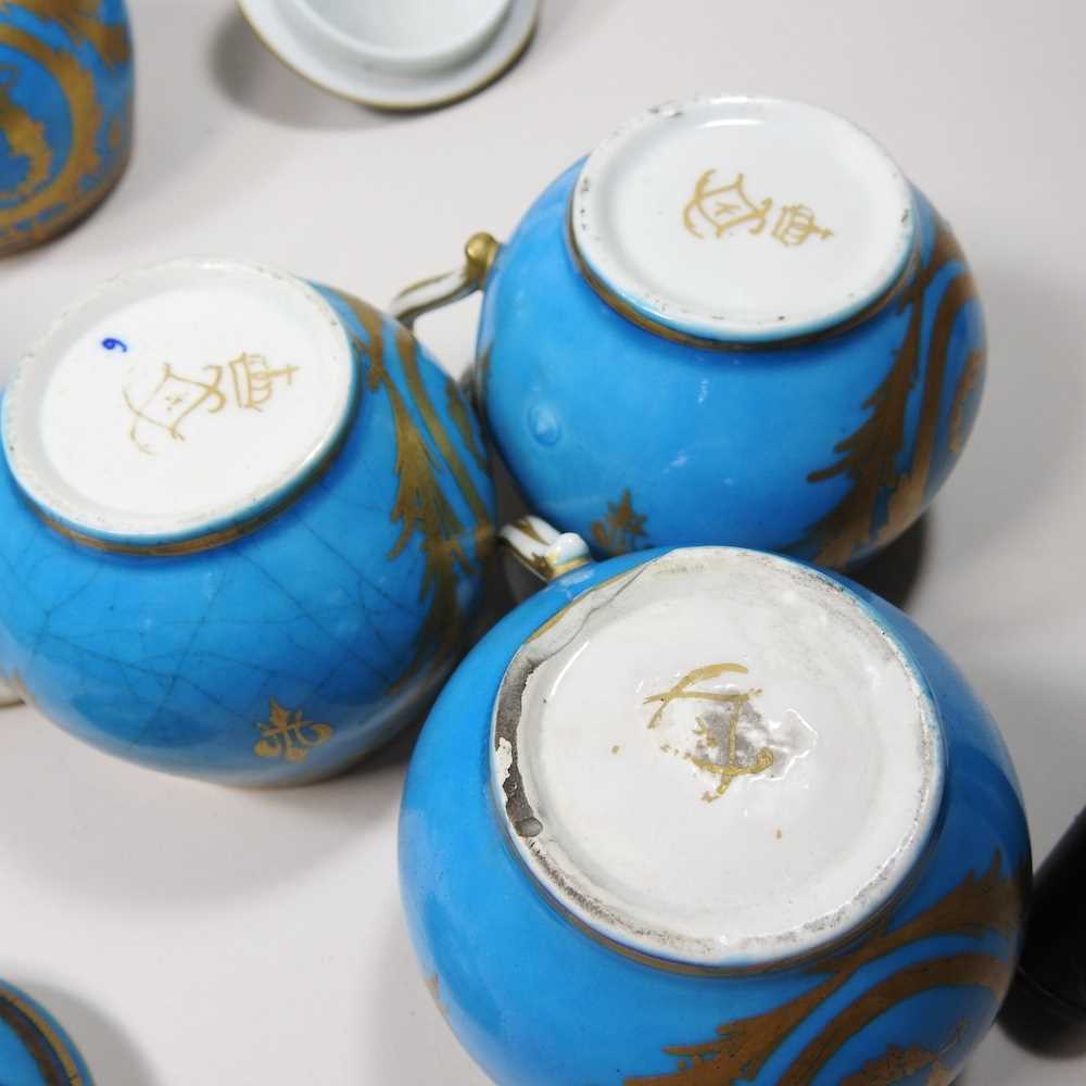 A set of eight 19th century Sevres porcelain custard cups and covers, with gilt decoration on a blue - Image 15 of 15