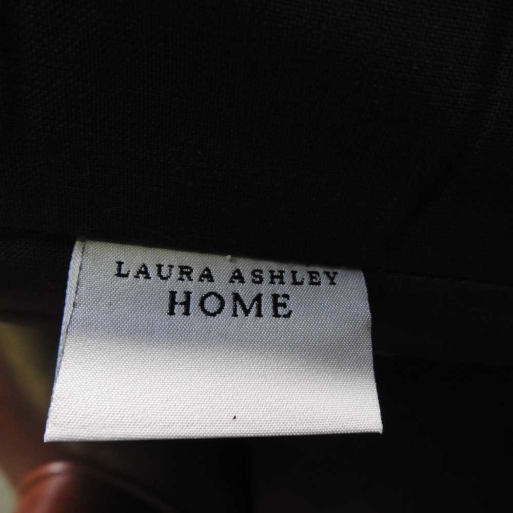 A Laura Ashley brown leather upholstered wing armchair, on turned legs - Image 2 of 7